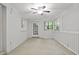 Living room with lots of light, ceiling fan, and french door access at 68 La Rue Nw Pl, Atlanta, GA 30327