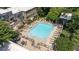 This image shows a luxurious pool area with plentiful seating, mature trees, and community barbecue at 68 La Rue Nw Pl, Atlanta, GA 30327