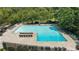 This image shows a large swimming pool with plenty of seating for residents and visitors at 68 La Rue Nw Pl, Atlanta, GA 30327