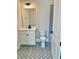 Bathroom featuring patterned tile flooring, toilet and vanity with stylish fixtures at 7220 Winderlea Ln, Cumming, GA 30040