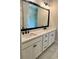Modern bathroom with double sinks, a large mirror, and a glass-enclosed shower at 7220 Winderlea Ln, Cumming, GA 30040