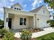 Charming single-Gathering home with a covered porch, manicured landscaping, and a two-car garage at 7220 Winderlea Ln, Cumming, GA 30040