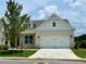 Beautiful single-Gathering home with a well-manicured front lawn and attached garage at 7220 Winderlea Ln, Cumming, GA 30040