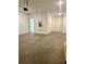 Spacious two-car garage featuring ample storage space and an access door at 7220 Winderlea Ln, Cumming, GA 30040