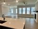Bright and airy living room with a fireplace and an open concept design at 7220 Winderlea Ln, Cumming, GA 30040