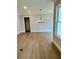 Spacious living room with hardwood floors, recessed lighting, and a modern chandelier at 7220 Winderlea Ln, Cumming, GA 30040