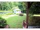 Landscaped backyard featuring a shed with a well-maintained lawn at 742 Starlight Ne Ct, Sandy Springs, GA 30342