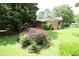 The back of the house is surrounded by a beautiful backyard and shed at 742 Starlight Ne Ct, Sandy Springs, GA 30342