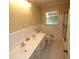 Bathroom featuring a double sink vanity and a shower/tub combination at 742 Starlight Ne Ct, Sandy Springs, GA 30342