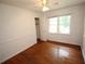 Bedroom featuring hardwood floors and natural light from a window at 742 Starlight Ne Ct, Sandy Springs, GA 30342