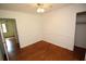 Bedroom featuring hardwood floors with natural light from a doorway at 742 Starlight Ne Ct, Sandy Springs, GA 30342