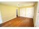 Bedroom offers classic hardwood floors, closet space, and natural lighting at 742 Starlight Ne Ct, Sandy Springs, GA 30342