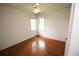 Bedroom with hardwood floors and a ceiling fan, offering ample natural light at 742 Starlight Ne Ct, Sandy Springs, GA 30342
