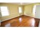 Sunny bedroom with hardwood floors and traditional window shutters at 742 Starlight Ne Ct, Sandy Springs, GA 30342