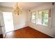Formal dining room with hardwood floors, chandelier lighting, and large windows at 742 Starlight Ne Ct, Sandy Springs, GA 30342