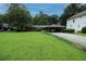 Charming single-story brick home featuring lush landscaping and a covered parking area at 742 Starlight Ne Ct, Sandy Springs, GA 30342