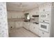 Functional kitchen offering white appliances and ample cabinet space for storage at 742 Starlight Ne Ct, Sandy Springs, GA 30342