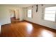 Bright living room with hardwood floors, neutral walls, and access to other rooms at 742 Starlight Ne Ct, Sandy Springs, GA 30342