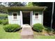 Exterior view of a storage shed with opened doors and a concrete path at 742 Starlight Ne Ct, Sandy Springs, GA 30342