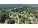 An aerial shot showcasing the neighborhood with mature trees and the home's location, enhanced with an inset image at 4345 Mantle Ridge Dr, Cumming, GA 30041
