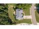 Aerial view of a home showcasing roof, landscaping, and surrounding neighborhood at 4345 Mantle Ridge Dr, Cumming, GA 30041