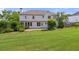 Large backyard with manicured lawn and a two-story home's exterior at 4345 Mantle Ridge Dr, Cumming, GA 30041