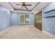 Bedroom featuring a tray ceiling, carpet and a double door closet at 4345 Mantle Ridge Dr, Cumming, GA 30041