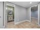 Hallway leading to bathroom with vanity and a carpeted bedroom at 4345 Mantle Ridge Dr, Cumming, GA 30041