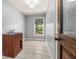Laundry room features sink, wood cabinet and a window at 4345 Mantle Ridge Dr, Cumming, GA 30041