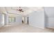 Spacious main bedroom with carpeting, a ceiling fan, and tray ceilings at 4345 Mantle Ridge Dr, Cumming, GA 30041