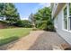 Lovely brick patio with lush green lawn and manicured landscaping at 4345 Mantle Ridge Dr, Cumming, GA 30041