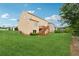 Expansive backyard featuring a well-maintained lawn and a wooden deck, ideal for outdoor gatherings at 506 Spring View Dr, Woodstock, GA 30188
