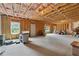 Unfinished basement features concrete floors and exposed framing, offering customizable space with potential at 506 Spring View Dr, Woodstock, GA 30188