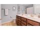 Bathroom featuring a double sink vanity with matching faucets at 506 Spring View Dr, Woodstock, GA 30188