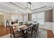 Elegant dining room with a modern chandelier, neutral walls, and wood floors throughout at 506 Spring View Dr, Woodstock, GA 30188