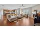 Bright and open living room features hardwood floors, a fireplace, and seamless flow to the kitchen at 506 Spring View Dr, Woodstock, GA 30188