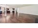 Spacious finished basement area with dark wood-like floors and an island kitchen at 5900 Fairington Farms Lane Ln, Stonecrest, GA 30038