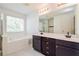 Bathroom boasts double vanity, soaking tub, and separate shower at 5900 Fairington Farms Lane Ln, Stonecrest, GA 30038