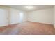 Carpeted bedroom with a door and entry to another room, providing a cozy and private retreat at 5900 Fairington Farms Lane Ln, Stonecrest, GA 30038