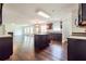 Open concept kitchen and living room with island, stainless steel appliances, and ample counter space at 5900 Fairington Farms Lane Ln, Stonecrest, GA 30038