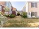 Backyard and landscaped yard, featuring a colonnade in between two houses at 8095 Georgetown Cir, Suwanee, GA 30024