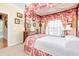 Bedroom featuring a canopy bed, neutral walls, and a window with shutter blinds at 8095 Georgetown Cir, Suwanee, GA 30024