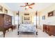 Inviting bedroom with four-poster bed, soft carpet, and coordinated furniture adding a touch of sophistication at 8095 Georgetown Cir, Suwanee, GA 30024