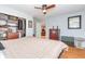 Bright bedroom features hardwood floors and a closet at 8095 Georgetown Cir, Suwanee, GA 30024