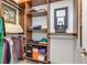 Organized walk-in closet with built-in shelving, hanging rods, and ample storage space at 8095 Georgetown Cir, Suwanee, GA 30024