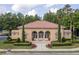 Elegant clubhouse featuring arched windows, manicured landscaping, and a welcoming entrance at 8095 Georgetown Cir, Suwanee, GA 30024