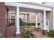 Brick walkway leads to a covered patio and exterior entrance at 8095 Georgetown Cir, Suwanee, GA 30024