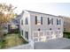 Three car garage with overhead lighting and finished floors and car collection at 8095 Georgetown Cir, Suwanee, GA 30024