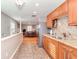 Bright kitchen features granite counters, stainless appliances, and wood cabinets at 8095 Georgetown Cir, Suwanee, GA 30024