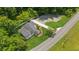 Lovely aerial shot of a home with a long driveway on well-maintained green property at 1480 Bettis Tribble Gap Rd, Cumming, GA 30040